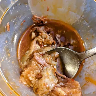 a bowl of food with a spoon in it