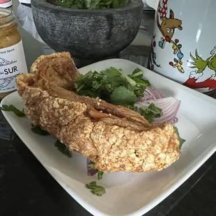 Chicharron fresh made. Cilantro onion grilled tomatoes. La Perla del Sur. Habanero salsas. Verde..