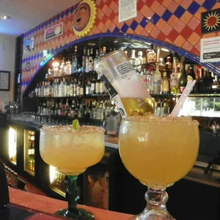 two glasses filled with drinks