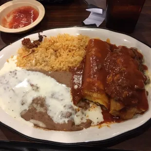 Combination #8 Beef Enchilada, Tamale with rice and beans.
