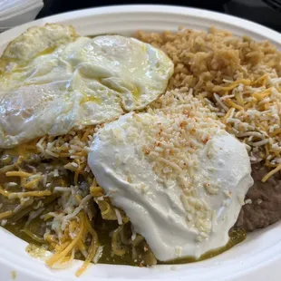 Chilequiles (green) w/eggs, beans, &amp; rice.