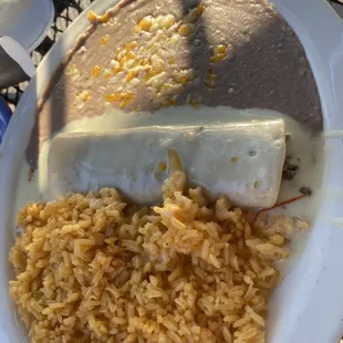 Ground beef enchilada, rice and beans. Delicious!