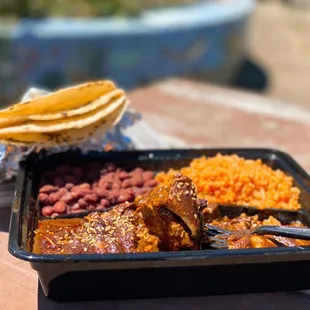 Mole Poblano w/ chicken, rice, beans, housemade tortillas | $19.95