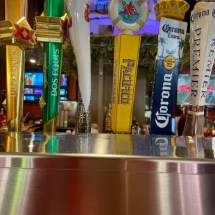 a row of beer taps