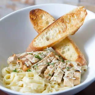 a bowl of chicken and noodles