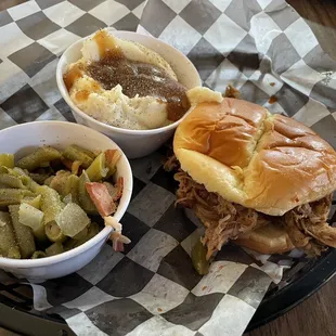 BBQ sandwich, green beans, and mashed potatoes and gravy