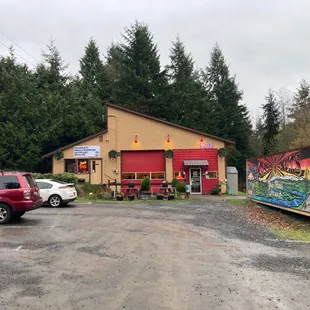 a truck parked in front of a restaurant