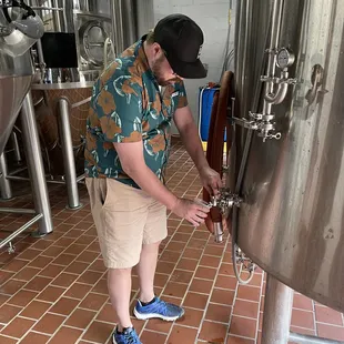 Sampling a fresh batch of beer