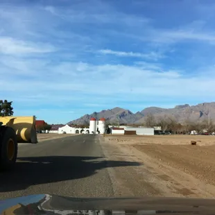  tractor driving down a dirt road
