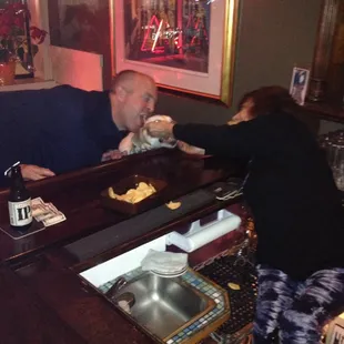 a man and a woman at a bar