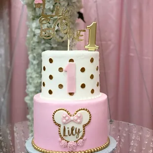 a pink and gold cake