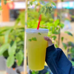 a person holding a drink
