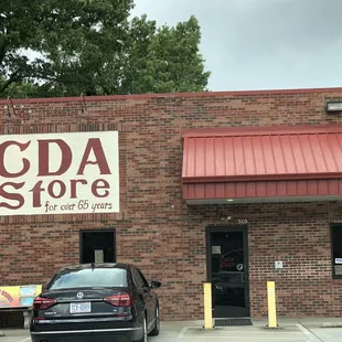 a car parked in front of a store