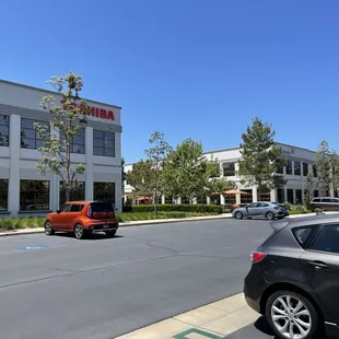 Walk in between the Toshiba and Skyworks buildings and you'll see the cafe entrance at the back end.