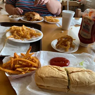 Fried chicken, onion rings, fries, shrimp poboy.