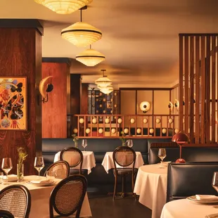 a dining room with tables and chairs