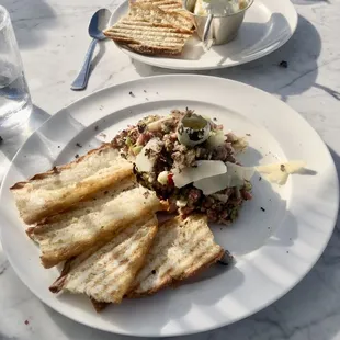 Beef tartare and Whipped Ricotta truffle honey with crostinis