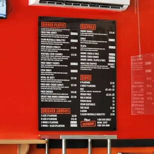 a menu on a red wall