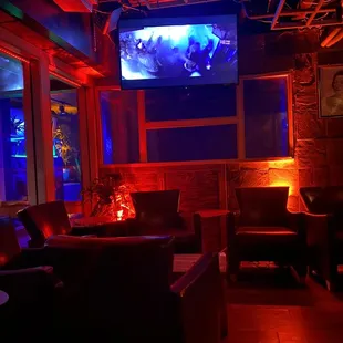 a television and leather chairs