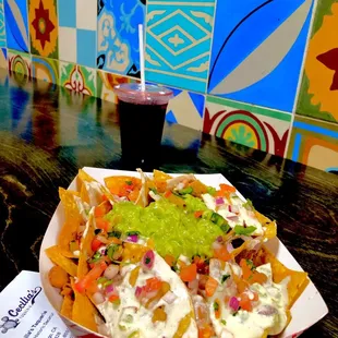 Refreshing Iced Jamaica (Hibiscus tea) but the Vegan Nachos is No Bueno=Not Good, stale chips, fake guac, fake cheese INEDIBLE!!