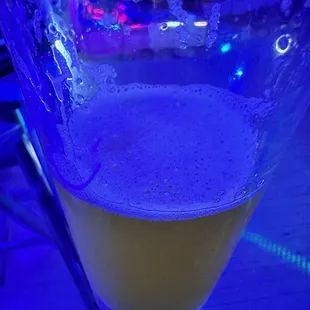 a glass of beer on a table