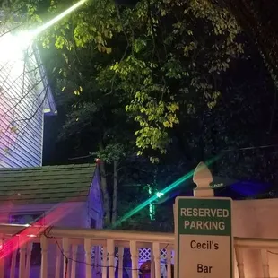 a street sign and a building at night