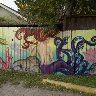 a mural of a woman and octopus