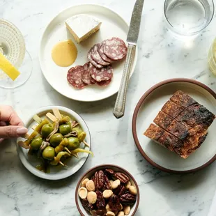 a plate of food and a glass of wine