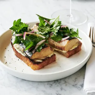 a plate of food and a glass of wine