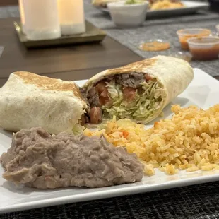 Burrito de Cecina with a side of dinner rice and beans