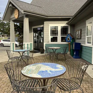 3 cafe tables on their patio