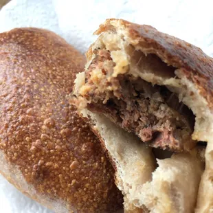 Delicious artisan take on a kolache: Locally made jalapeño sausage wrapped in artisan (sourdough?) bread... NOT your donut shop kolache!