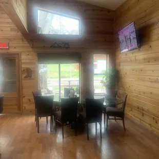 dining room with wood paneled walls