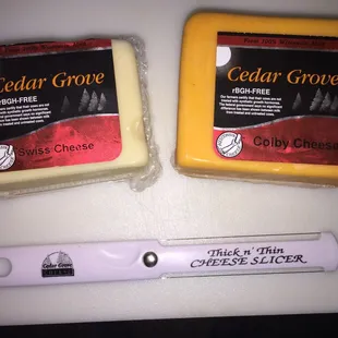 My favorite two kinds of cheese and a very clever wire cheese slicer from Cedar Grove.