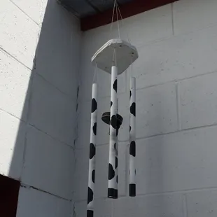 a cow print wind chime