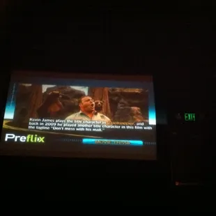 This is inside one of the 'micro' theaters. The screen is very small. Also, notice the prominence of the exit sign.