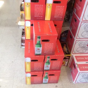 a stack of boxes of beer