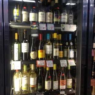 a refrigerator full of wine bottles