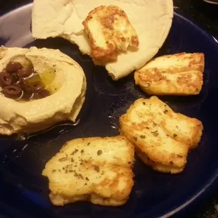 Pan fried halloumi cheese, hummus, and pita- all purchased from Cedar Market.  Just season cheese and fry in olive oil.