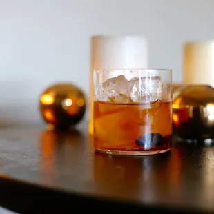 a glass of tea on a table
