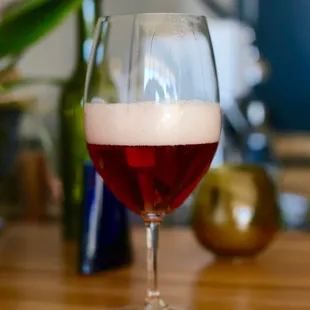 a glass of wine on a table