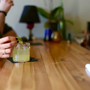 a man and a woman sitting at a bar