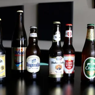 a variety of beer bottles on a table