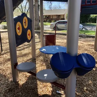 Table, seats, drums on the big kids play structure