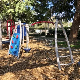 Toddler play structure. Recommended for ages 2-5 years with adult supervision. 1 slide, climbing wall, balance beam, stepping pods