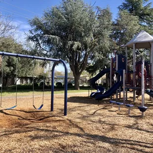 Big kid play structure. Recommended for ages 5-12 years with adult supervision. 4 slides, climbing ladder, 2 swings, stepping/jumping pods