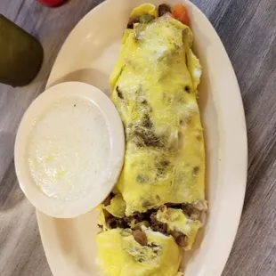 Cheesesteak omelet with grits