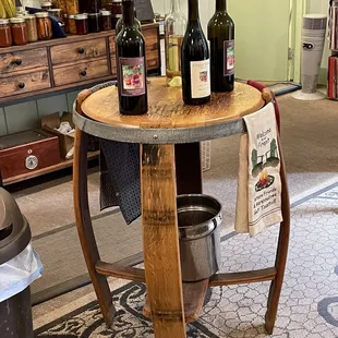 wine bottles on a barrel table