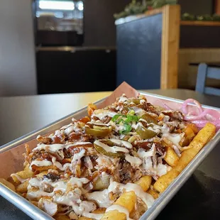 Our signature fries topped with your choice of meat (pork, chicken or brisket), fried onions, jalapenos, and ranch bbq sauce.