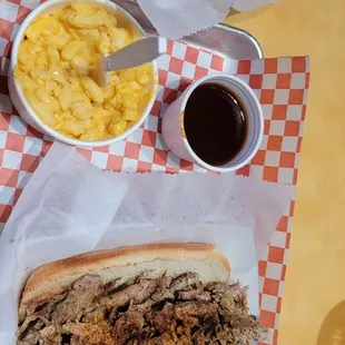 Pulled pork sandwich, mac &amp; cheese, fries and medium bbq sauce.